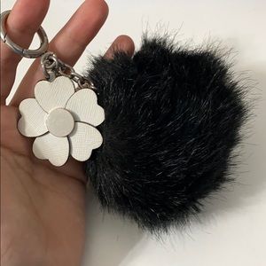 Michael Kors black Pom Pom key chain with flower